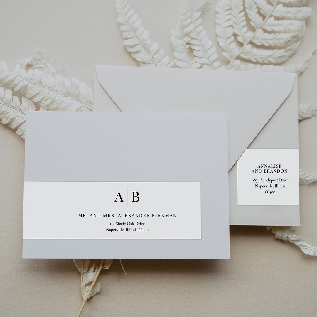 Monogram Envelope Labels on a neutral background with foliage