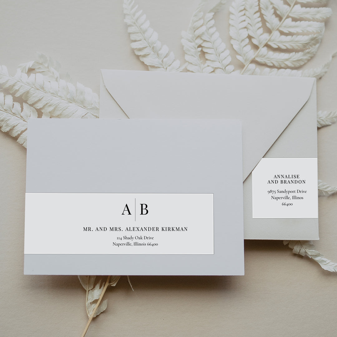 Monogram Envelope Labels on a neutral background with foliage