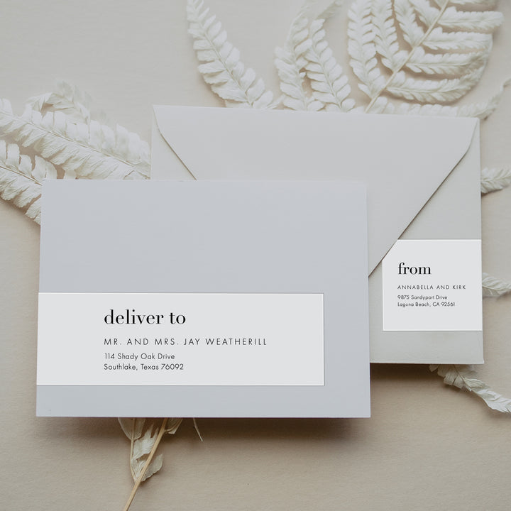 Grey envelope on neutral foliage background with wraparound Label. The Mad Love Collection