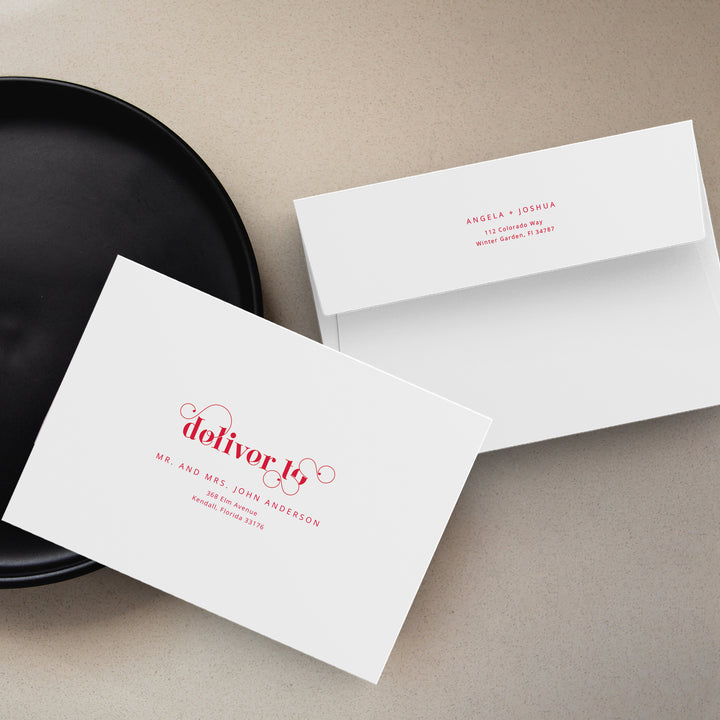 White Envelopes with Cherry Red Typeface on BeiGE bACKGROUND WITH bLACK pLATE