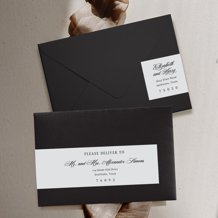 Two black envelopes with white return address labels on a neutral background
